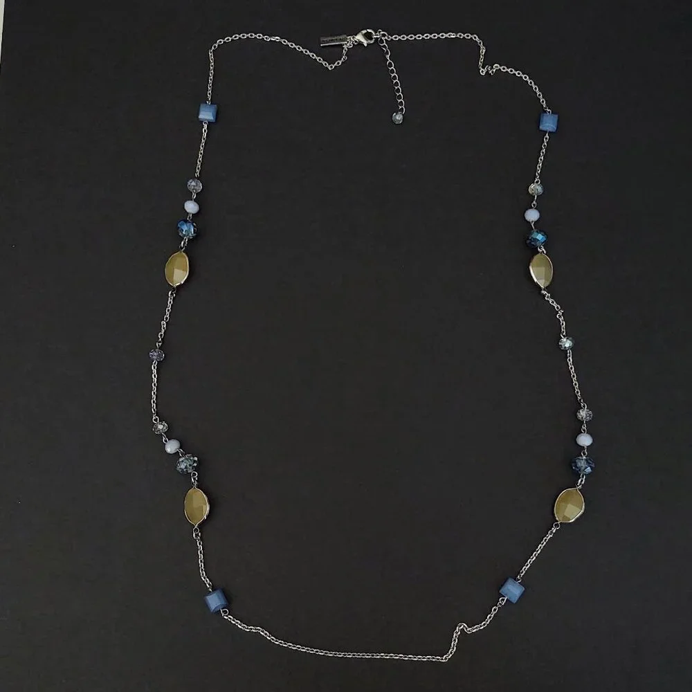 Long silver necklace with blue and yellow glass beads
